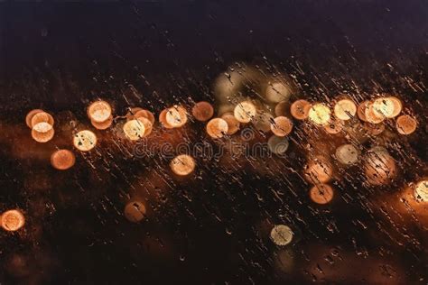 Abstract Blurred City Traffic Urban Bokeh Wet Window With Rain Drops