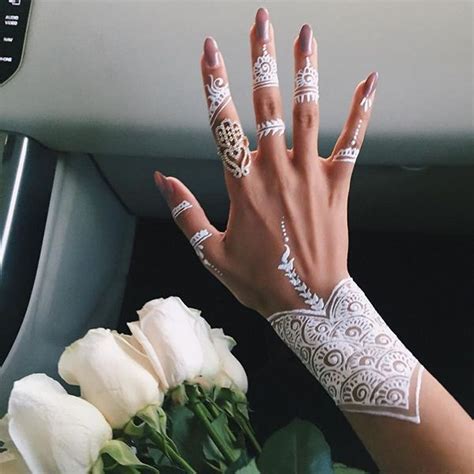 Females hand on her knee with a traditional henna tattoo in morocco. White Henna Designs for Beach Weddings, White Mehendi ...