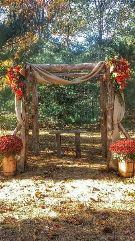 Cedar Arbor Decorated With Fall Flowers And Burlap Wedding Ceremony