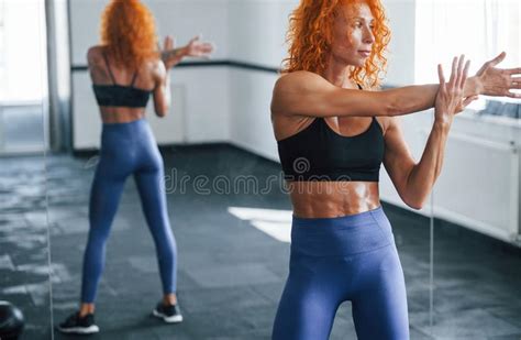 Warm Up Exercises Sporty Redhead Girl Have Fitness Day In Gym At