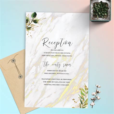 a white and gold wedding reception card with succulents on the front
