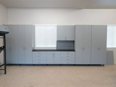 Maybe you would like to learn more about one of these? Grey garage cabinets with black workbench top and ...
