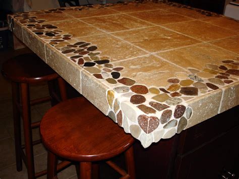 Since there are numerous decorative tiles to select from, a tile counter can be custom made to a showpiece. Riverstone and Travertine custom 4'x4' kitchen island ...