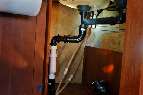 It started with getting water coming up on the regular side of the sink when i started using the disposal. Upgrading the RV Drain System with a HepvO Valve