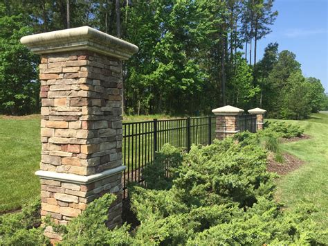 Stacked Stone Columns With Wrought Iron Fence Braemar Creek Idf Pensign