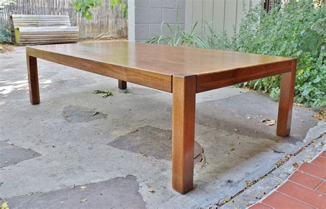 What is the most common feature for chrome coffee tables? Modwerks: Large Low Vintage Walnut Coffee Table