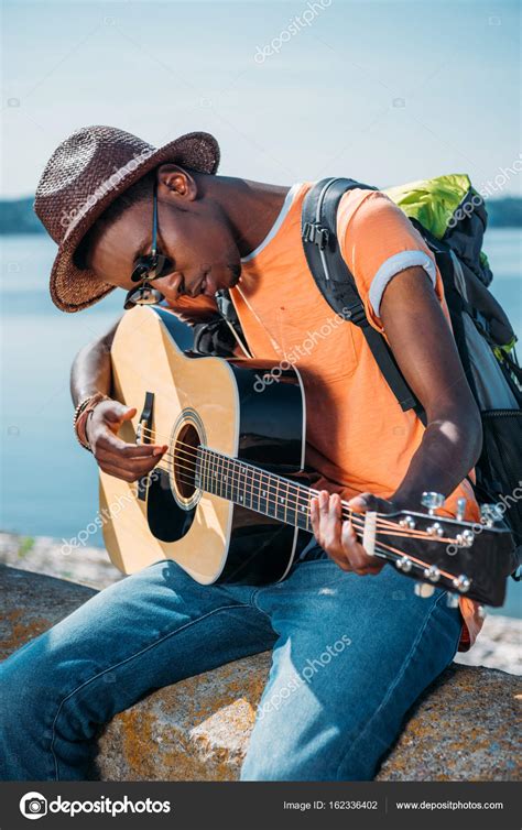 African American Man Playing Guitar — Stock Photo © Arturverkhovetskiy