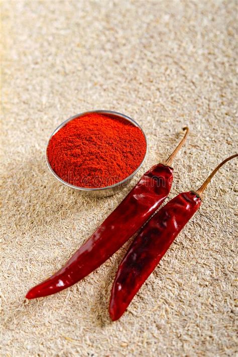 Red Chili Pepper Flakes And Chili Powder Burst Stock Photo Image Of