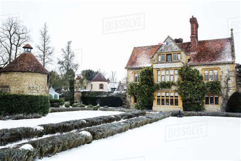 Historic 17th Century Manor House With Tall Chimneys A Hotel With Snow