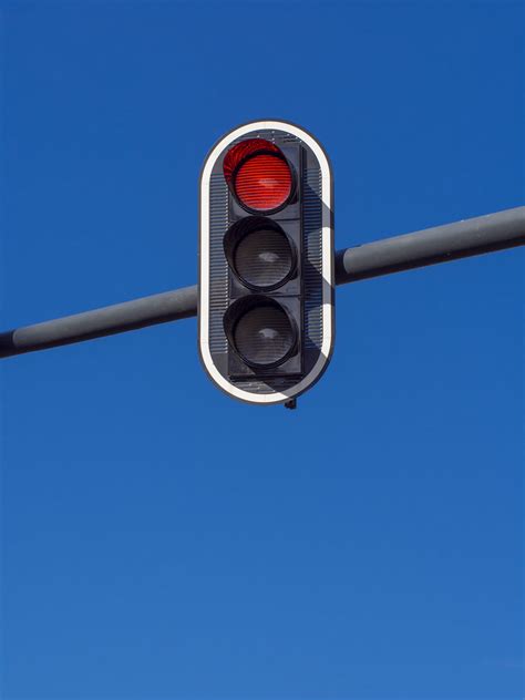 Red Traffic Light Is Hanging On Blue Sky Red Traffic Light Flickr