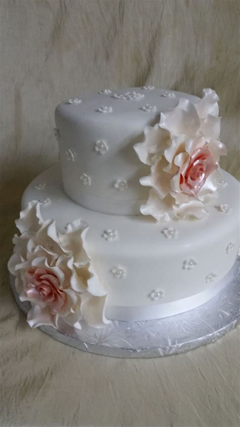 The wedding cake is often the focal point of a reception. The Cakebox Bahamas: Fondant finished 2-tier cake with ...