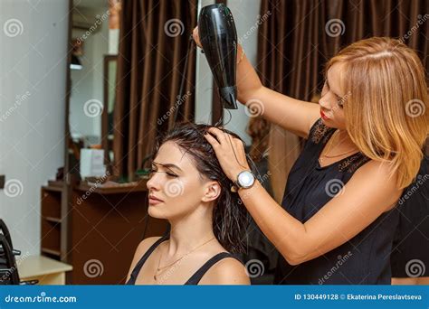 Professional Hairdresser With A Client In The Salon Stock Photo Image