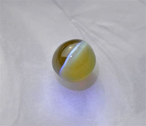 6 73 carat natural apple green cat s eye chrysoberyl gemstone ceylon elizabeth jewellers