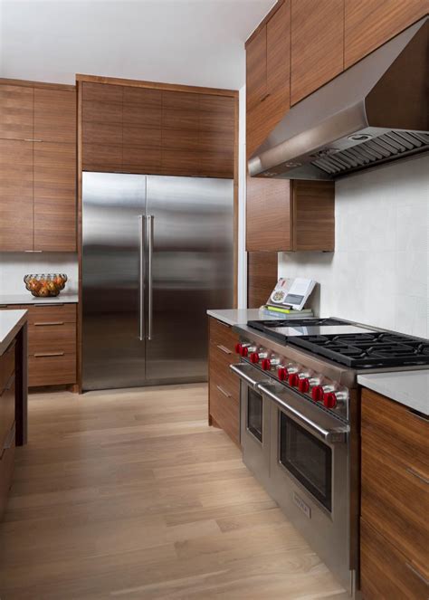 Modern Kitchen With Flat Front Walnut Cabinets And Stainless Steel