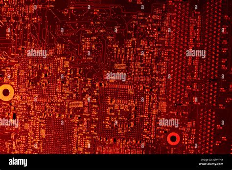 Full Frame Red Illuminated Printed Circuit Board Closeup Stock Photo