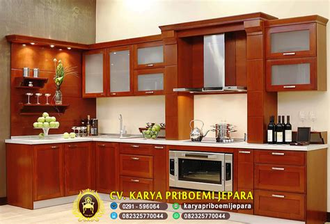 Gabungan warna hpl putih,hitam dan sedikit motif kayu di dalam rak cabinet atas membuat desain kitchen set terlihat minimalis dan modern. Pengrajin Kitchen Set Minimalis Jati Modern Harga Murah