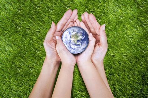 Sketches of hands holding earth coloring pages embroidery how to. Earth in hands. Gesture of two hands (mother and son) on ...