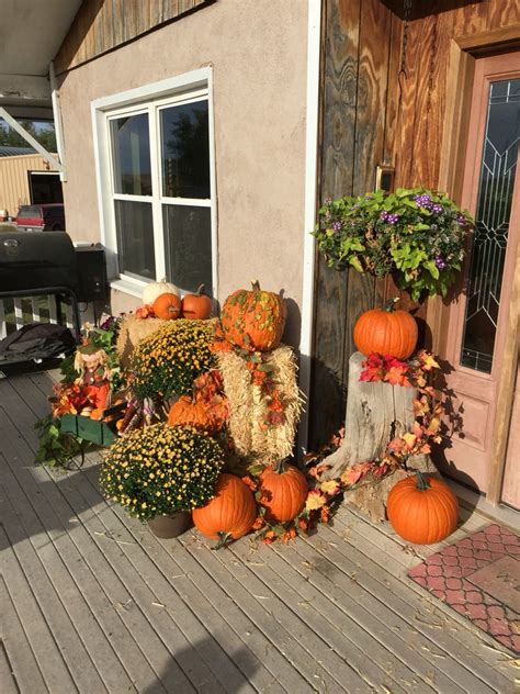 I Used Pumpkins Straw Bales Mums And Artificial Fall Flowers And