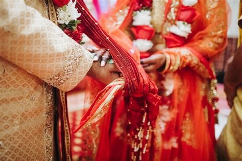 Hands Of Indian Bride And Groom Intertwined Together Making Authentic