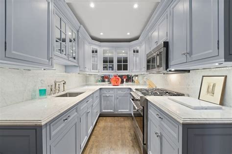 Add cupboards along the upper walls of your kitchen and remove the lower drawers. Get Small Kitchen Floor To Ceiling Kitchen Cabinets ...