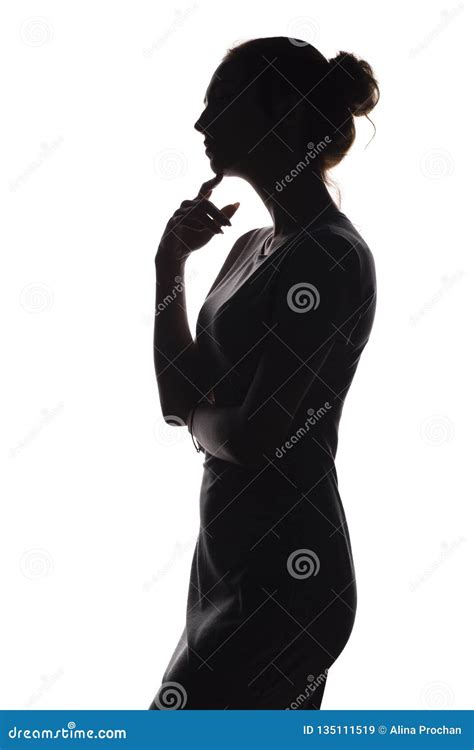 Silhouette Of A Pensive Woman With The Hand At The Chin On A White