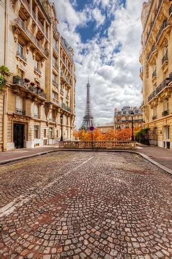 Eiffel Tower Seen From The Street In Paris France Cobblestone Pavement