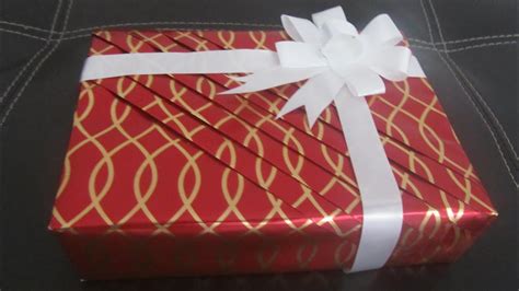 Place the box facedown on top of your gift wrap, leaving the paper attached to roll. Part 1 Pleated wrapping - How to wrap your gifts in an ...