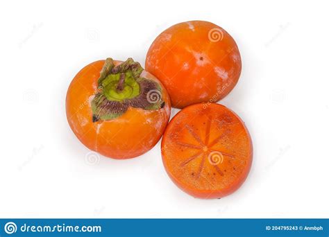 Whole And Cut Across Oriental Persimmons On A White Background Stock