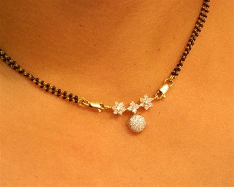40 latest gold mangalsutra designs to try in (2021) march 2021 gold mangalsutra enhances the beauty of a woman and it signifies faithfulness towards her husbands and husband's promise to shield her wife the entire life. Short Mangalsutra Designs Gold Latest 2018