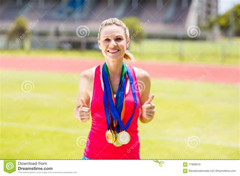 Portrait Of Happy Female Athlete With Gold Medals Stock Image Image Of Cheerful Ribbon