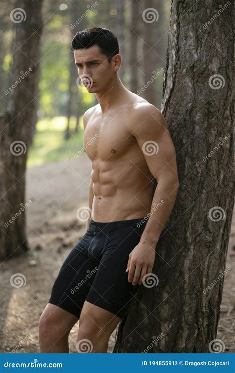 Athlete Shirtless Muscular Man In Sportwear Showing Six Pack Abs