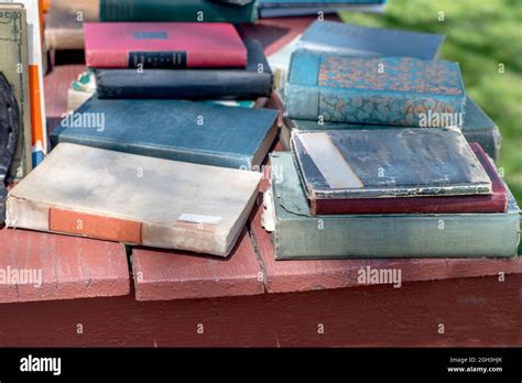 Piles Of Old Books For Sale At An Outdoor Yard Sale Stock Photo Alamy