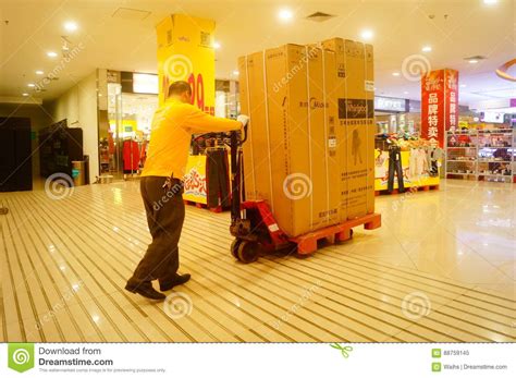 Home improvement tools, lawn & garden supplies, other home goods at best price Shenzhen, China: Carrefour Supermarket Employees Carry ...