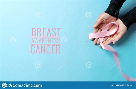 Pink Badge Ribbon On Woman Hand To Support Breast Cancer Cause Breast Cancer Awareness Concept