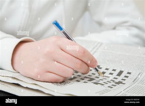 Person Doing Crossword Stock Photo Alamy