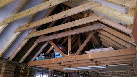 The cables and hydraulic hoses are routed under a base plate between the two posts. removing a couple more roof joists in the garage roof ...