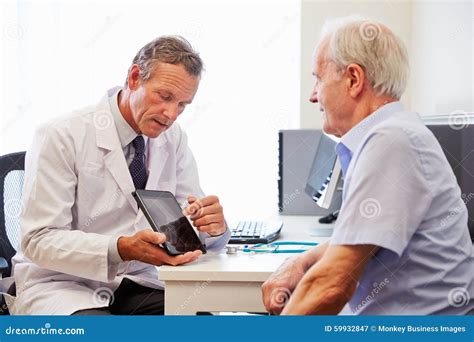 Senior Patient Having Consultation With Doctor In Office Stock Image