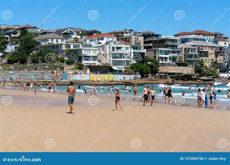 people enjoying hot sunny summer day on bondi beach in sydney nsw australia editorial image