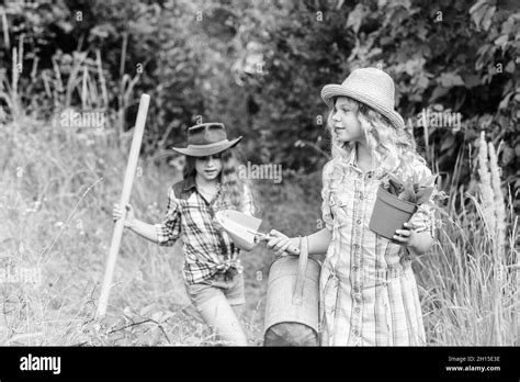 Sisters Helping At Farm Girls With Gardening Tools Eco Farming