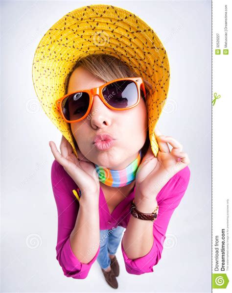 Pretty Girl With Yellow Summer Hat Giving A Kiss Royalty