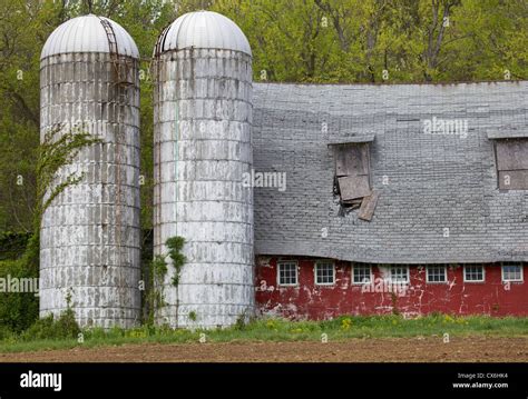 Weathered Red Barn With Grain Silos Stock Photo Alamy