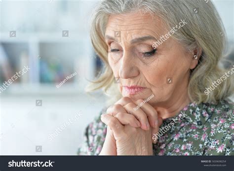 Close Portrait Sad Senior Woman Posing Stock Photo 1659698254