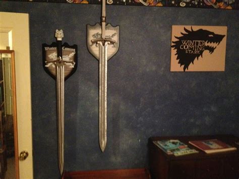 This sword pommel printer vertically, but has no solid base, so you will nee to use supports. Longclaw and ice, with needle on the way. : gameofthrones