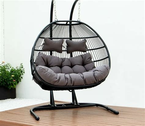 Hanging egg shaped swing seat. Egg shaped seat includes grey or white