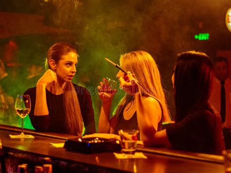 Group Of Female Friends Enjoying Night Out At Rooftop Bar Editorial Stock Image Image Of
