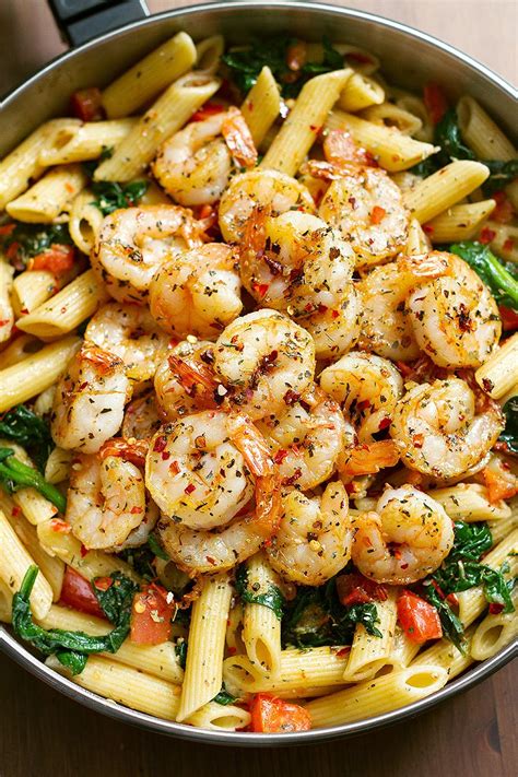 Shrimp sautéed in olive oil with ginger, garlic, and colorful red and green bell pepper, tossed with angel hair pasta. Best Ever Tomato Spinach Shrimp Pasta - 4u1s