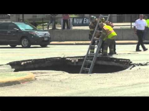 Raw Woman Rescued After Driving Into Sinkhole Youtube