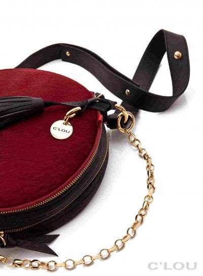 Tasche mit kordelverschluss durchbrochenes kalbsleder, bedruckter stoff & goldfarbenes metall. Labels to watch: Labels to go