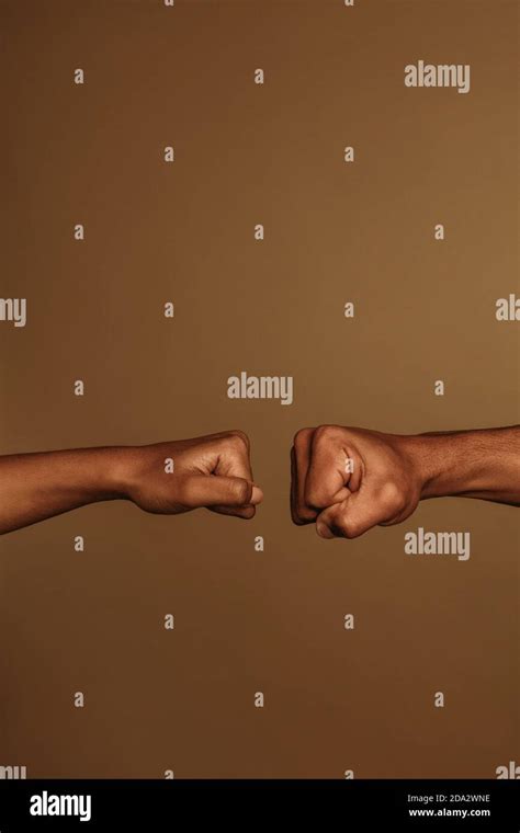 Two Fists Together Hi Res Stock Photography And Images Alamy