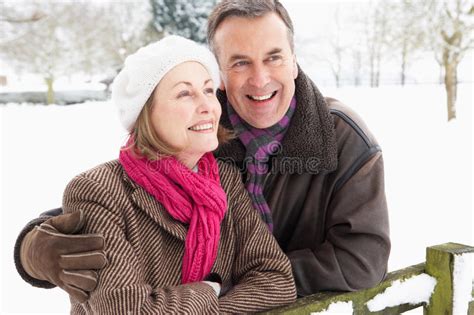 Senior Couple Standing Outside In Snowy Landscape Stock Image Image